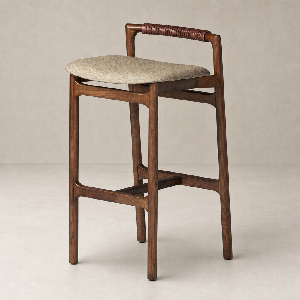Nadia Bar + Counter Stool in Alcala Wheat with wooden frame and woven backrest.