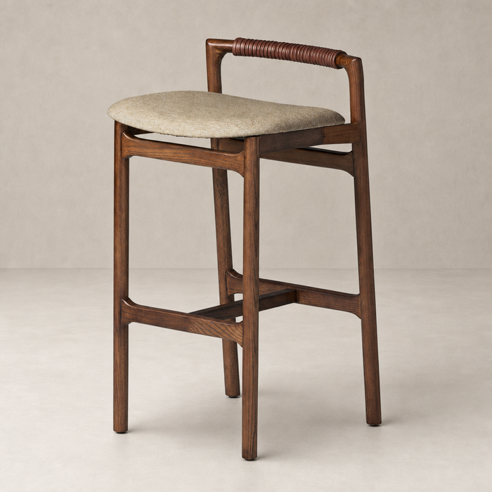 Nadia Bar + Counter Stool in Alcala Wheat with wooden frame and woven backrest.