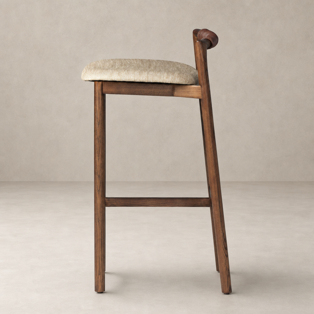 Nadia Bar + Counter Stool in Alcala Wheat with elegant curved back and wooden legs.