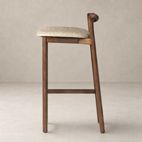 Nadia Bar + Counter Stool in Alcala Wheat with elegant curved back and wooden legs.