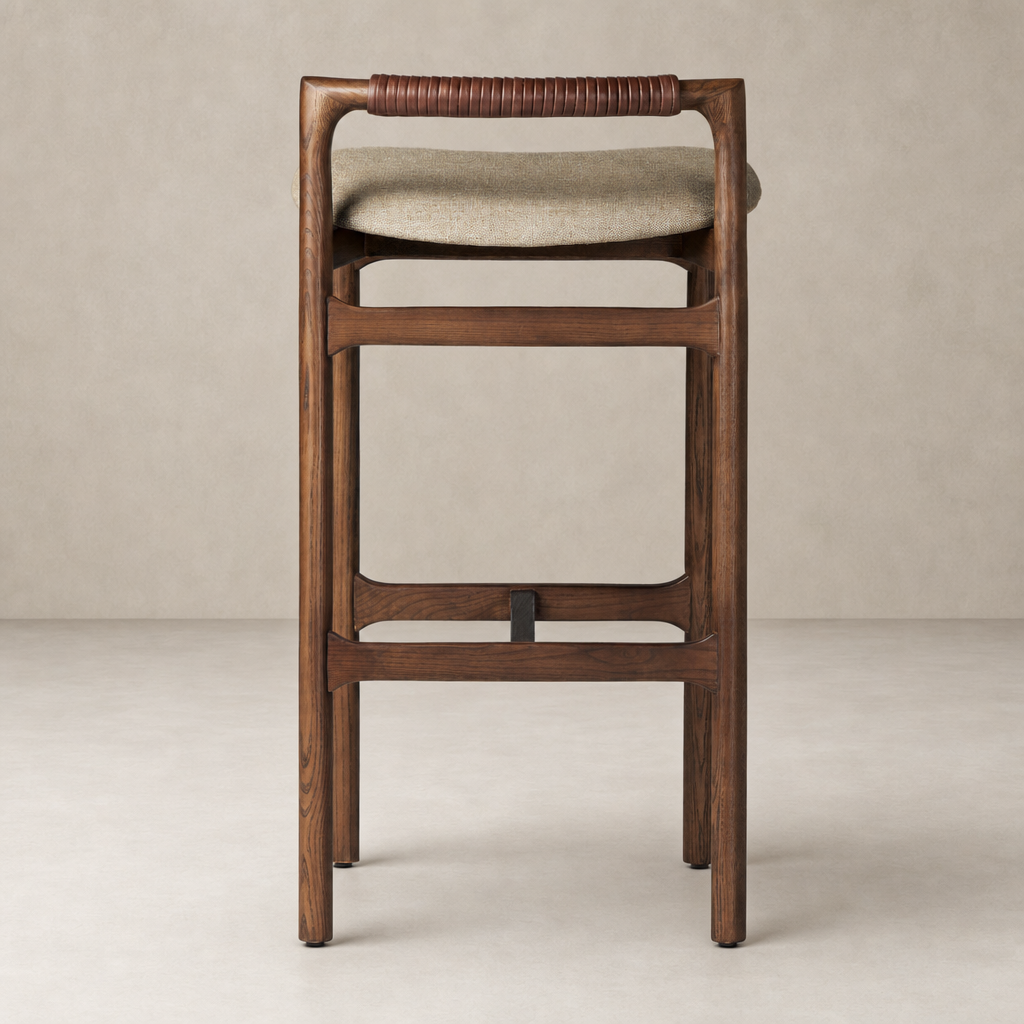 Nadia Bar + Counter Stool in Alcala Wheat with a sleek wooden frame and cushioned seat.