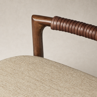 Nadia Bar + Counter Stool featuring Alcala Wheat fabric and a stylish wood armrest.