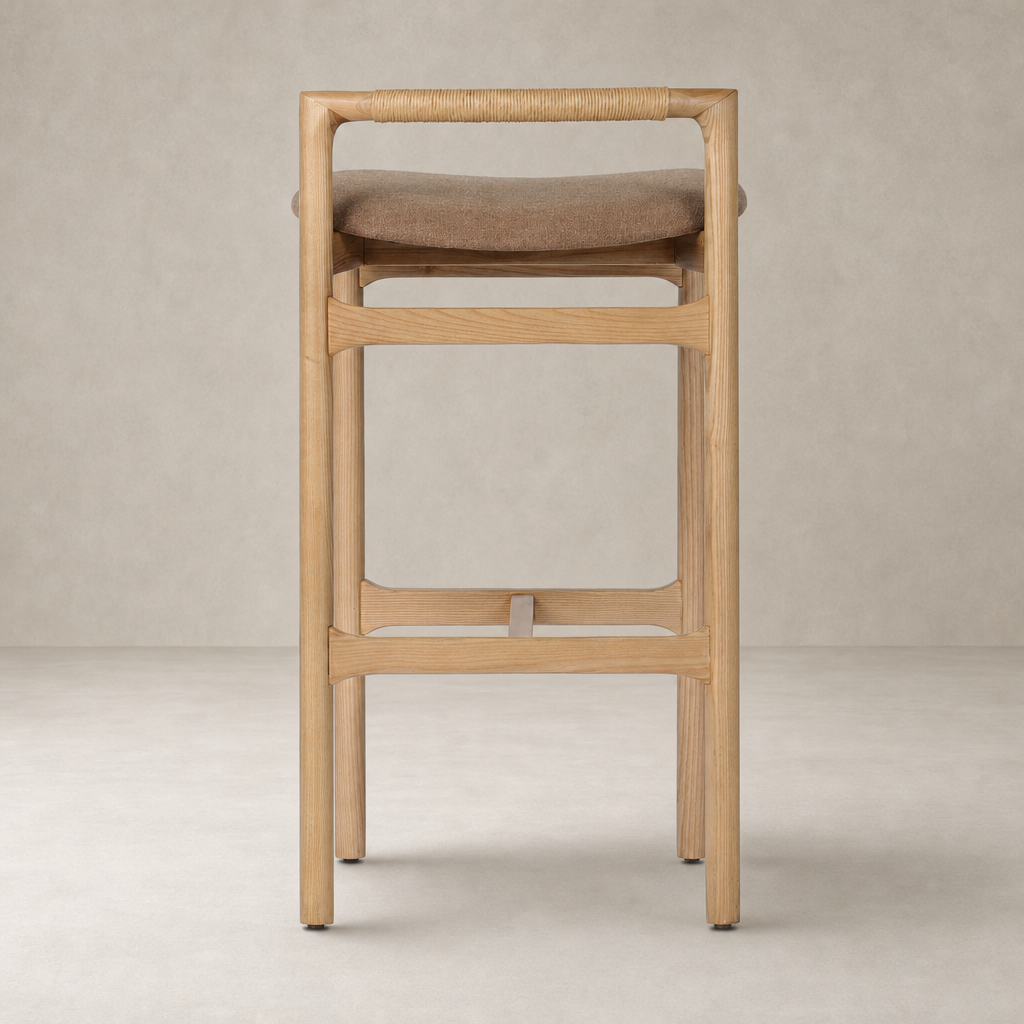 Nadia Bar + Counter Stool in Antwerp Cafe features a sleek wooden frame and comfortable padded seat.