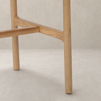 Nadia Bar + Counter Stool features a sleek Antwerp Cafe finish and sturdy wooden legs.