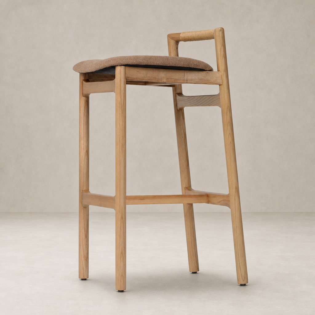 Nadia Bar + Counter Stool in Antwerp Cafe with a sleek wooden frame and fabric seat.