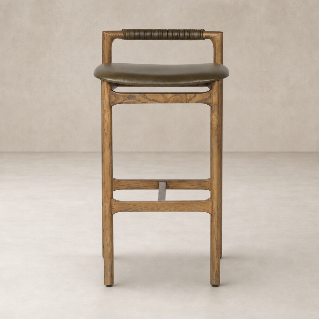Nadia Bar + Counter Stool in Dulane Moss with a sleek wooden frame and curved seat.