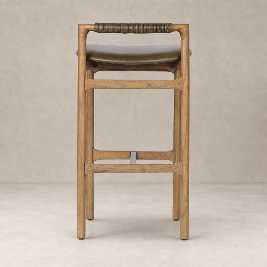 Nadia Bar + Counter Stool in Dulane Moss with wooden frame and wrapped handle detail.