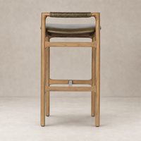 Nadia Bar + Counter Stool in Dulane Moss with wooden frame and wrapped handle detail.