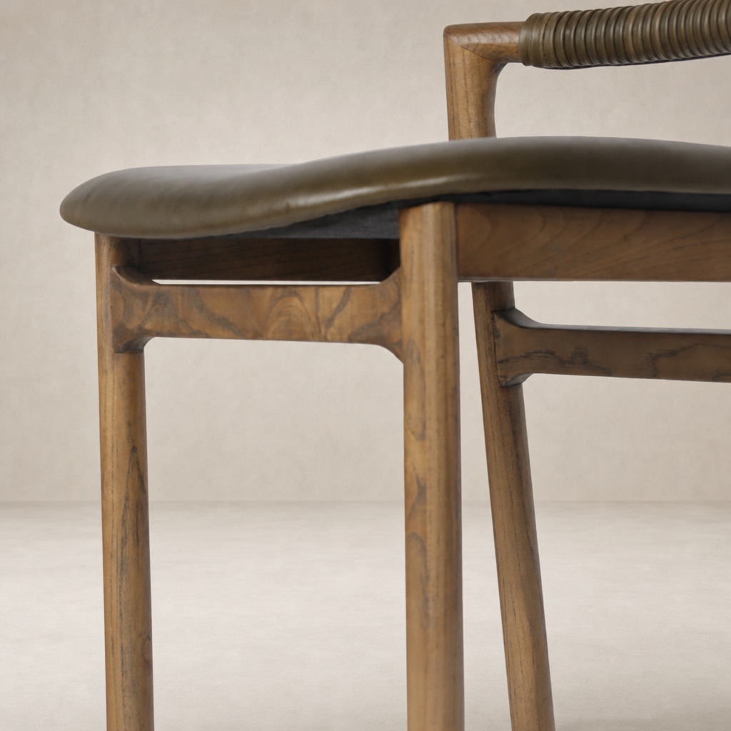 Nadia Bar + Counter Stool in Dulane Moss with a sleek wooden frame and padded seat.