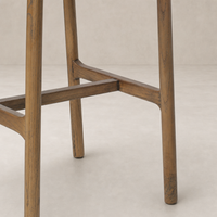 Nadia Bar + Counter Stool in Dulane Moss showcasing sturdy wood legs and seamless design.
