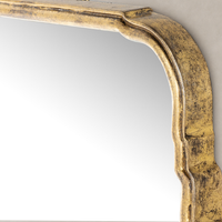 Antiqued Gold Leaf Rhone Mirror with ornate curved edges and textured finish.