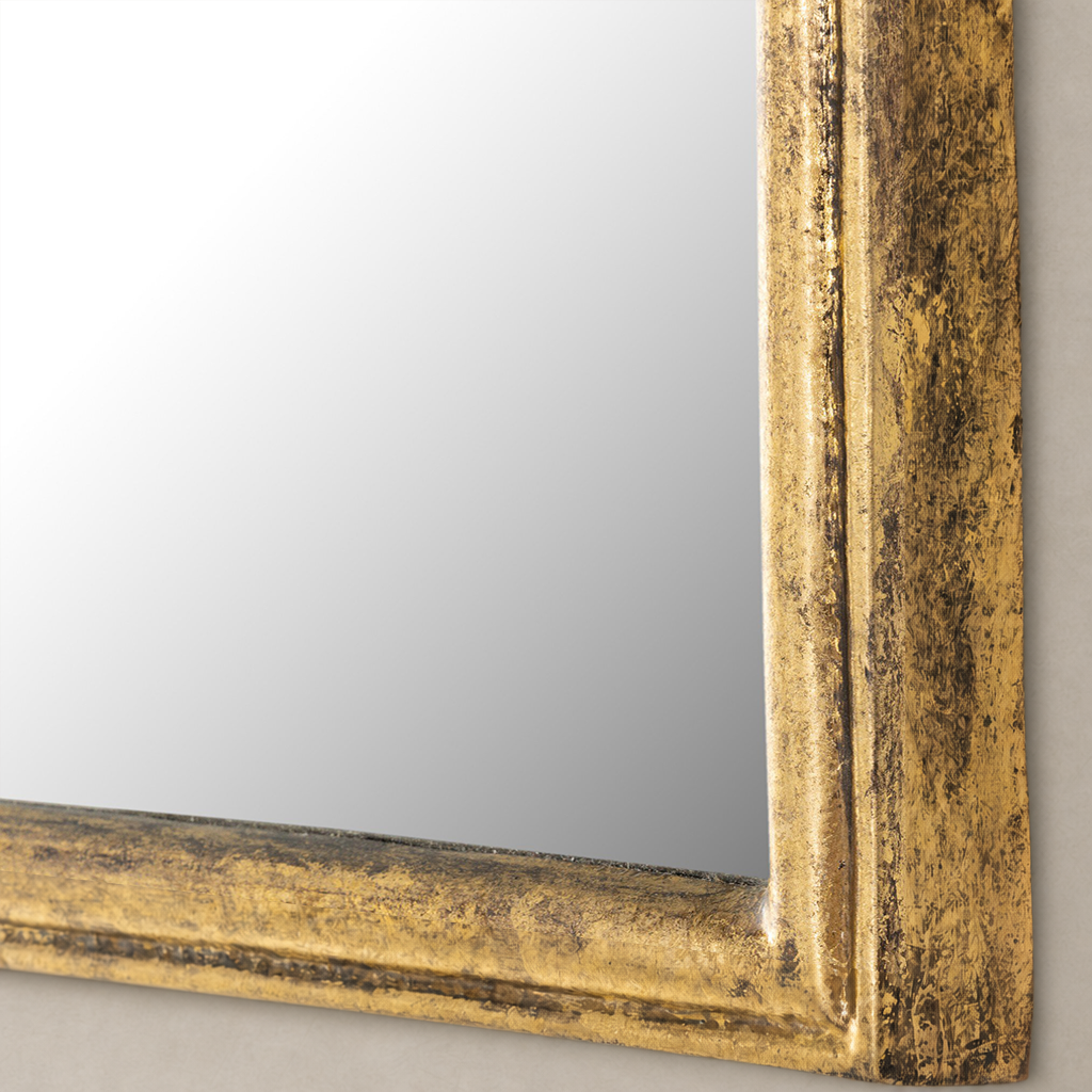 Close-up of the Rhone Mirror with an antiqued gold leaf frame detailing.