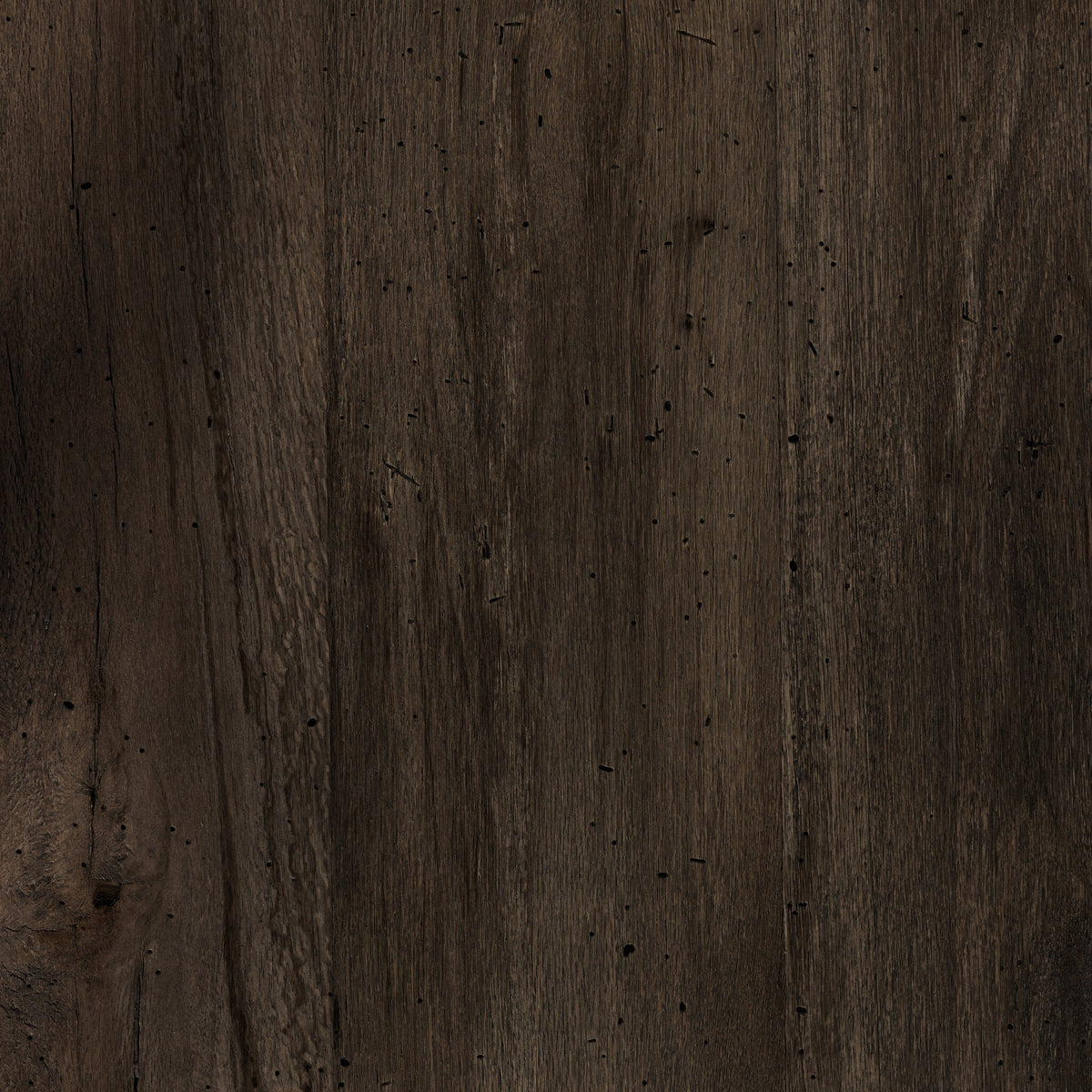 Textured close-up of the Brisa Dining Table in ebony rustic wormwood oak.