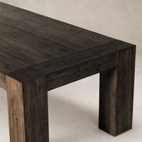 Brisa Dining Table in Ebony Rustic Wormwood Oak with a sturdy, textured finish.