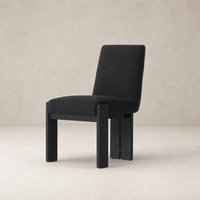 Romy Dining Chair in Gibson Black with a sleek, modern design and comfortable upholstery.