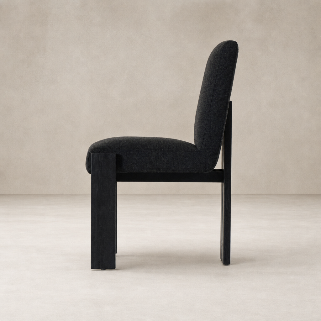 Romy Dining Chair in Gibson Black, featuring a sleek modern design and cushioned seat.
