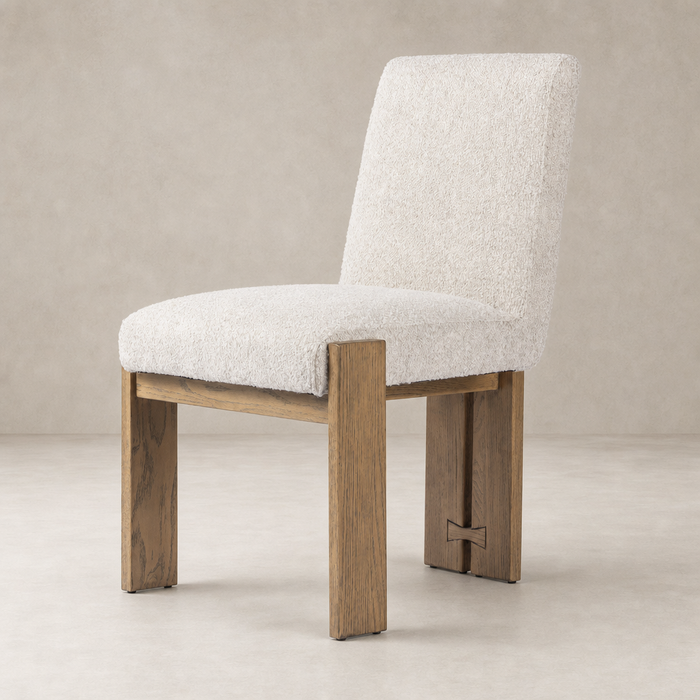 Romy Dining Chair in Somerton Ash with textured upholstery and sturdy wooden legs.