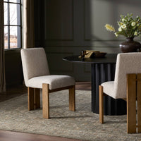Romy Dining Chair in Somerton Ash with textured upholstery and sturdy wooden legs.