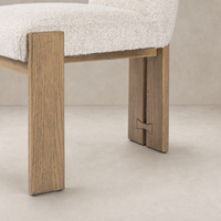 Romy Dining Chair in Somerton Ash with plush upholstery and sturdy wooden legs.
