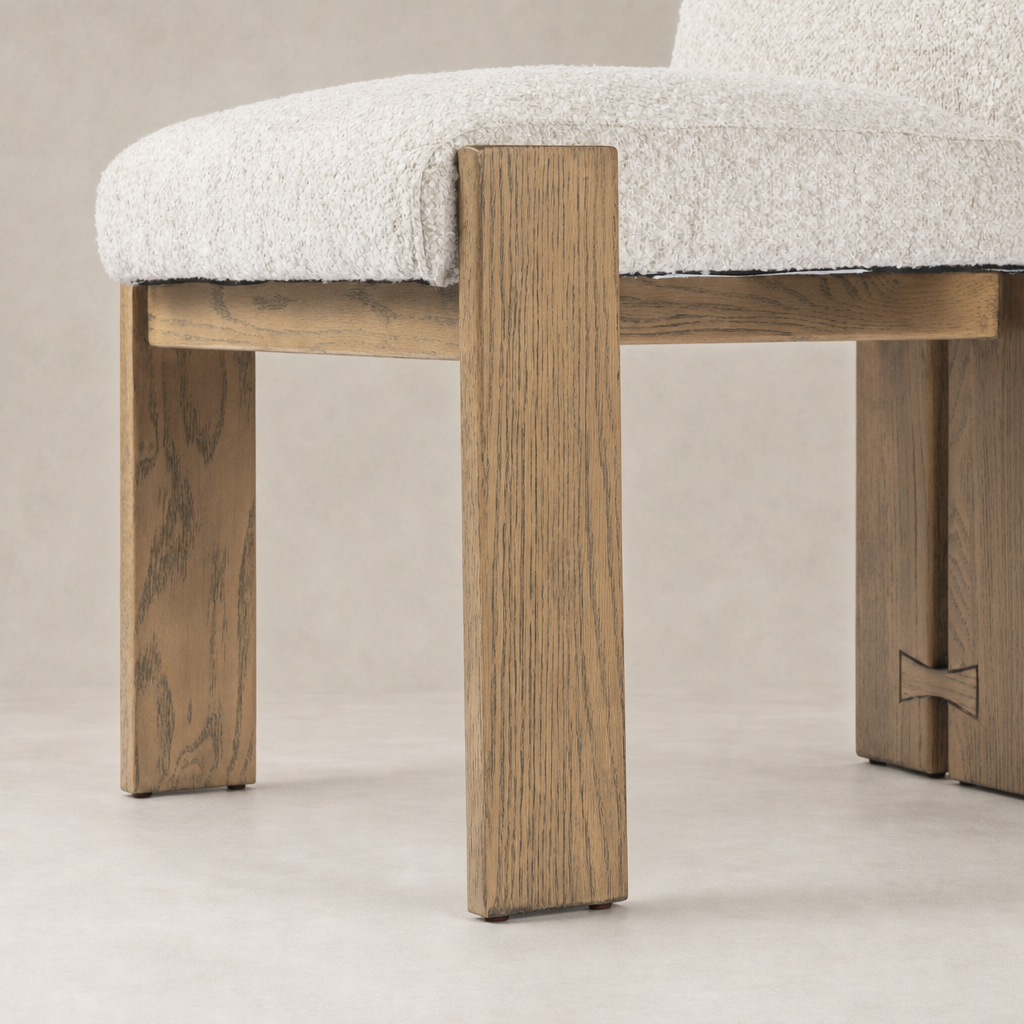 Romy Dining Chair in Somerton Ash featuring textured fabric upholstery and sturdy, angular wooden legs.