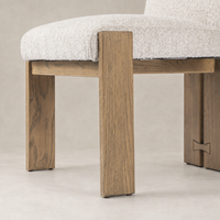 Romy Dining Chair in Somerton Ash featuring textured fabric upholstery and sturdy, angular wooden legs.