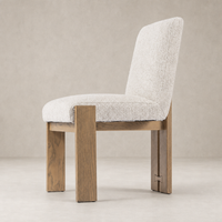 Romy Dining Chair in Somerton Ash with plush textured upholstery and sturdy wooden legs.