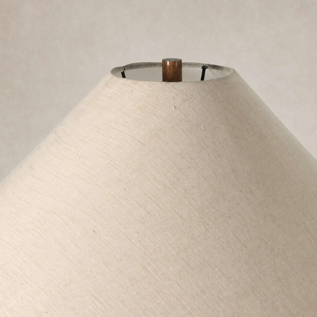 Iridescent acid wash floor lamp with a textured cone-shaped shade in a soft hue.
