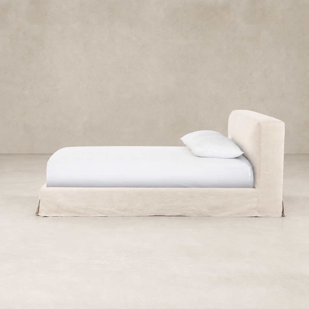 Slipcover bed in Brussels Natural fabric with a clean and modern design.