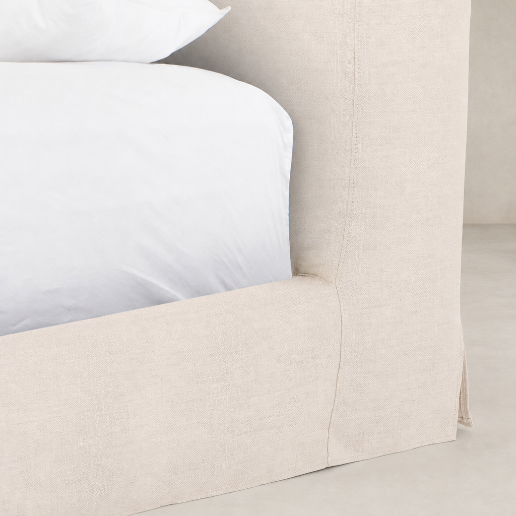 Slipcover bed in Brussels Natural with soft, textured fabric and clean lines.