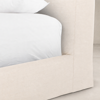 Slipcover bed in Brussels Natural fabric with clean lines and soft texture.