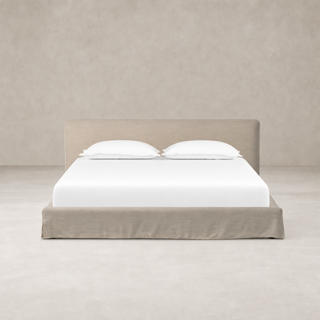 Slipcover bed in Savoy Parchment featuring a soft, upholstered headboard and clean lines.