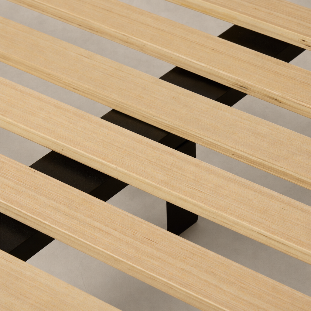 Close-up of a slipcover bed's wooden slats in Savoy Parchment finish.