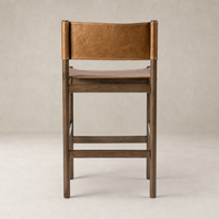 Bremen Bar + Counter Stool in Sonoma Butterscotch with a sleek wooden frame and leather seat.
