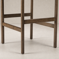 Bremen Bar + Counter Stool in Sonoma Butterscotch showcasing sturdy legs and rich wood texture.