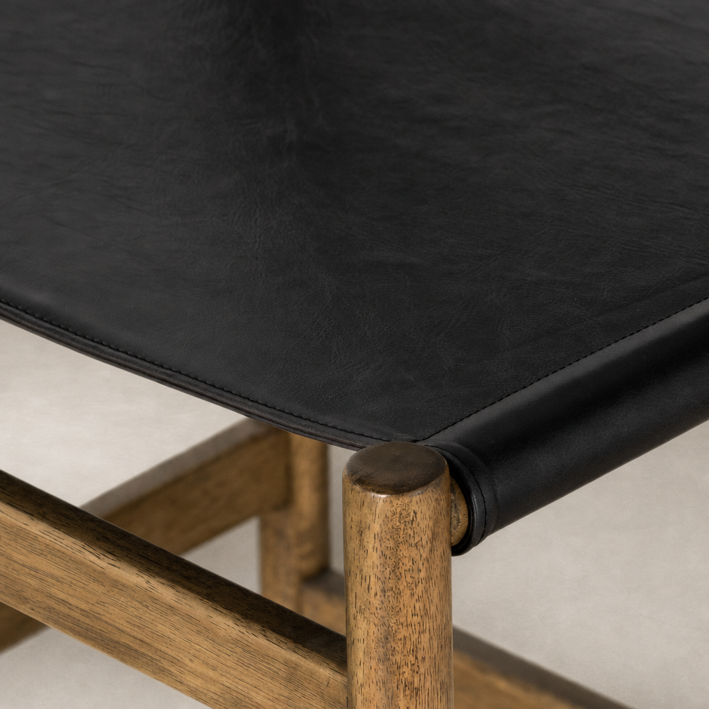 Bremen Bar + Counter Stool with Sonoma Black seat and solid Parawood base details.