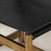 Bremen Bar + Counter Stool with Sonoma Black seat and solid Parawood base details.