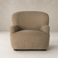 Ojai Chair in Sheepskin Camel featuring a cozy, textured upholstery and rounded arms.