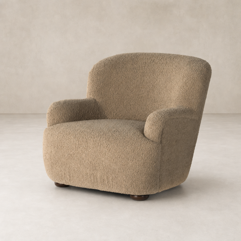 Ojai Chair in Sheepskin Camel with rounded shape and textured upholstery.
