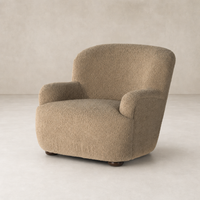 Ojai Chair in Sheepskin Camel with rounded shape and textured upholstery.