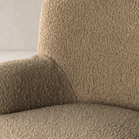 Close-up of Ojai Chair in Sheepskin Camel, showcasing its soft, textured fabric.