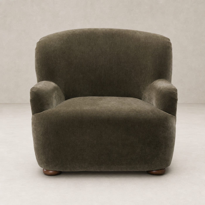 Stylish Ojai Chair in Malmo Olive with soft curves and cozy fabric texture.