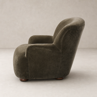 Olive Malmo fabric Ojai Chair featuring a rounded silhouette and warm wooden legs.
