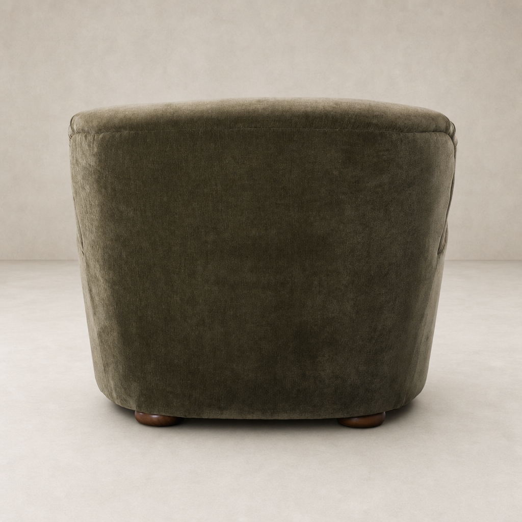 Ojai Chair in Malmo Olive featuring a rounded, plush back and wooden legs.