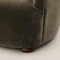 Malmo Olive Ojai Chair featuring a soft, textured fabric and rounded wooden base.