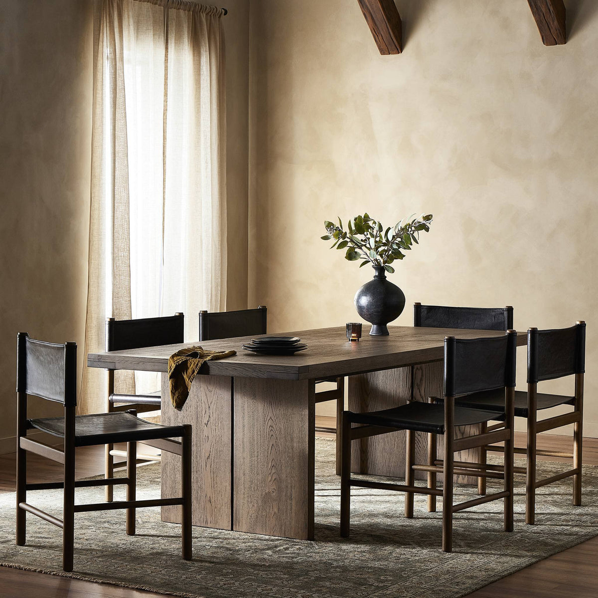 Sevilla Dining Table in worn oak, featuring a sleek, rectangular design and elegant texture.
