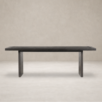 Sevilla Dining Table in worn black oak with a minimalist design and sturdy legs.
