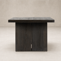 Sevilla Dining Table in worn black oak with a sleek modern design.