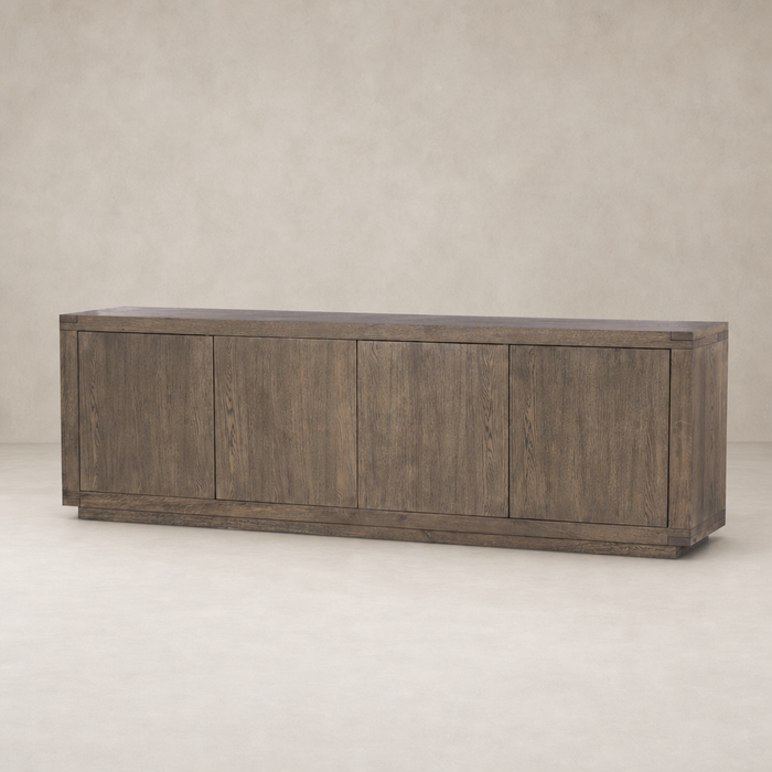 Whitby Sideboard in worn oak features a sleek, modern design with four spacious cabinets.