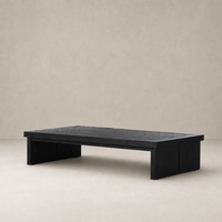 Darby Coffee Table in worn black featuring a simple, rectangular design and sturdy legs.