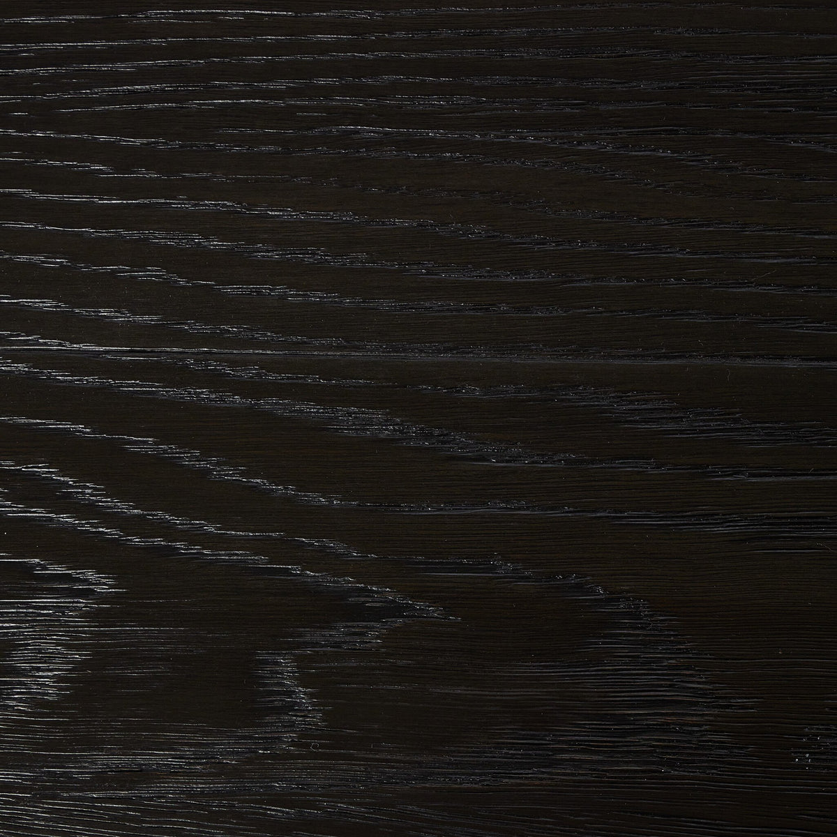 Worn black wood texture of the Darby Coffee Table surface detail.